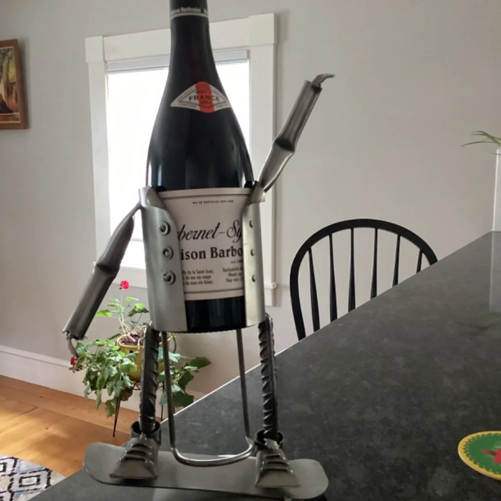 Wine bottle holder H & K steel on person on Skateboard?